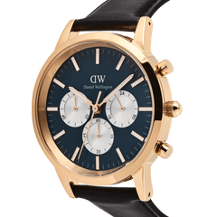 Daniel Wellington Iconic Chronograph watch with a rose gold case, arctic blue panda dial, and black leather strap.
