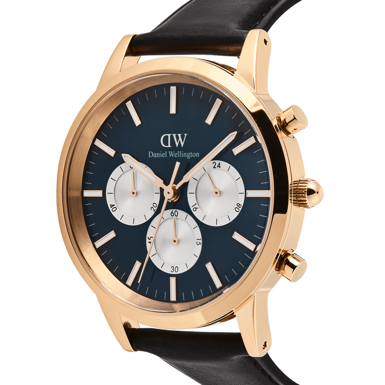 Daniel Wellington Iconic Chronograph watch with a rose gold case, arctic blue panda dial, and black leather strap.