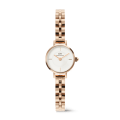 Daniel Wellington Petite Mini Arch watch with a white dial and a rose gold 3-link bracelet.