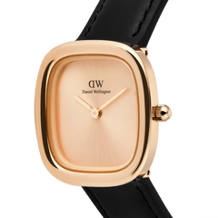 Daniel Wellington Margot Sheffield watch with a rose gold cushion case, minimalist sunray unitone dial, and a black leather strap.