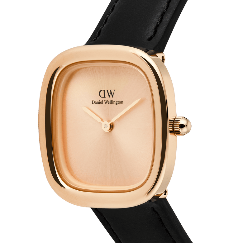 Daniel Wellington Margot Sheffield watch with a rose gold cushion case, minimalist sunray unitone dial, and a black leather strap.