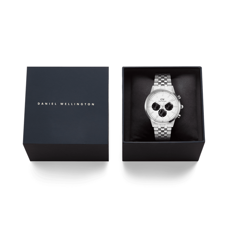 The Daniel Wellington Iconic Chronograph Arch watch in silver with an off-white panda dial and a 5-link bracelet, presented in its black brand box.